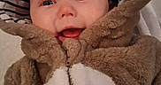 Thea joined the competition — help win amazing prizes! baby, child, smiling, face, hood, costume, fuzzy, clothing, cute, portrait, infant, warm, striped, happy, eyes, mouth, person, indoor, soft, babywear