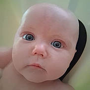 Thea is registered to the contest to win money with this photo: baby, infant, face, blue_eyes, closeup, skin, head, expression, portrait, child, young, cute, innocent, curious, human, person, soft_light, indoors, newborn, looking