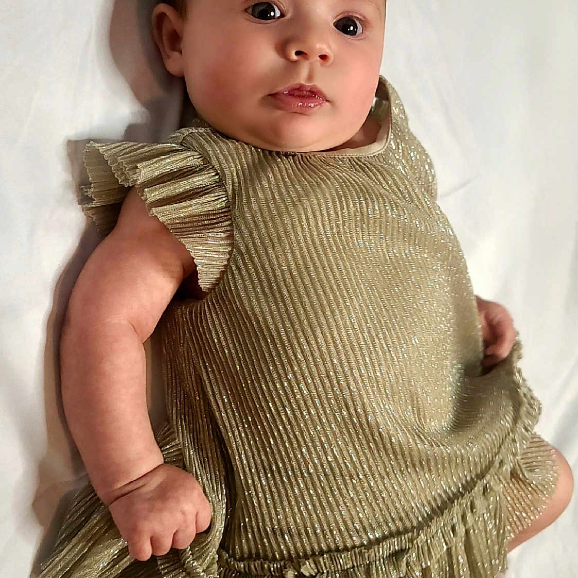 Jordan joined the competition — help win amazing prizes! baby, bodypart, bonnet, cap, clothing, dress, face, fashion, finger, formalwear, hand, hat, head, knitwear, pants, person, photography, portrait, sleeve, sweater
