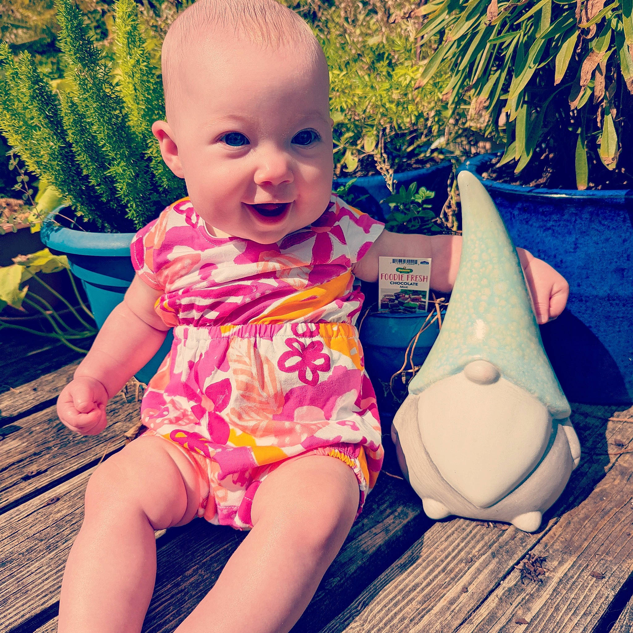 Calliope joined the competition — help win amazing prizes! baby_toddler_clothing, face, facial_expression, grass, green, happy, head, human_body, leg, leisure, mouth, organ, people_in_nature, person, pink, plant, skin, smile, standing, sunlight