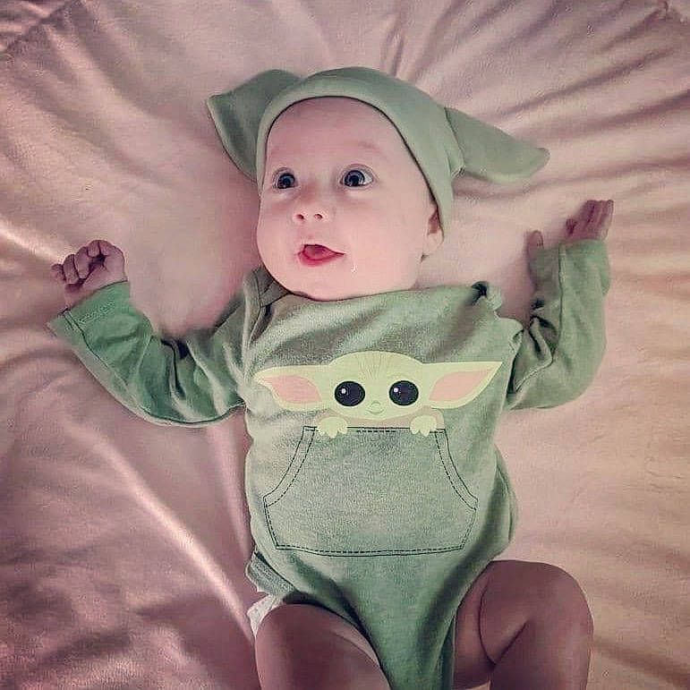 Calliope is registered to the contest to win money with this photo: arm, baby, baby_toddler_clothing, cheek, chin, comfort, eye, eyebrow, happy, head, headwear, human_body, iris, lip, mouth, nose, outerwear, person, skin, sleeve