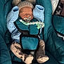 newborn, baby, sleeping, car_seat, knit_hat, pacifier, baby_clothing, infant, blue, teal, strap, cute, cozy, indoors, child, soft, peaceful, wrapped, small, wearing_hat