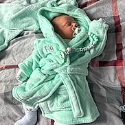 Blu joined the competition — help win amazing prizes! baby, bed, blanket, child, clothing, comfort, cozy, cute, indoor, infant, lying_down, mint_green, newborn, pacifier, peaceful, robe, sleeping, soft_texture, toddler, warm