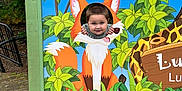 Malachi joined the competition — help win amazing prizes! child, face_cutout, fox, cartoon, colorful, jungle, greenery, outdoor, shoes, playful, board, painting, trees, plants, smiling, cute, fun, nature, wood, sign