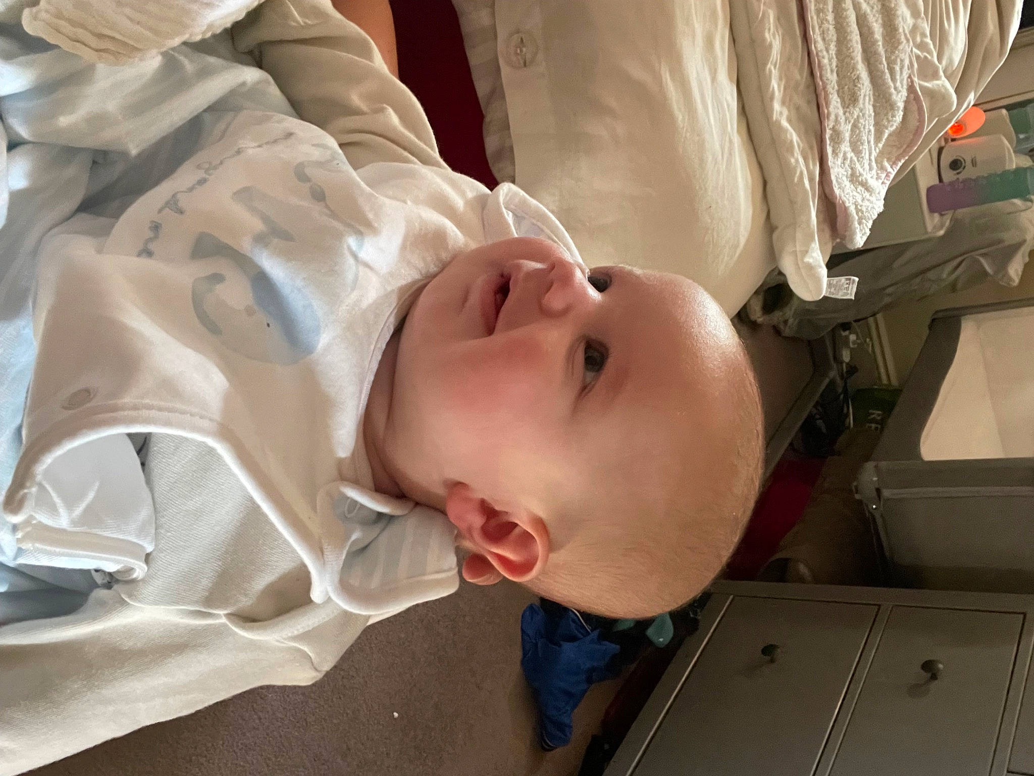 George is registered to the contest to win money with this photo: baby, baby_products, baby_safety, baby_toddler_clothing, cheek, child, comfort, eyebrow, eyelash, happy, hat, headgear, lip, mouth, nose, person, room, sleeve, smile, toddler