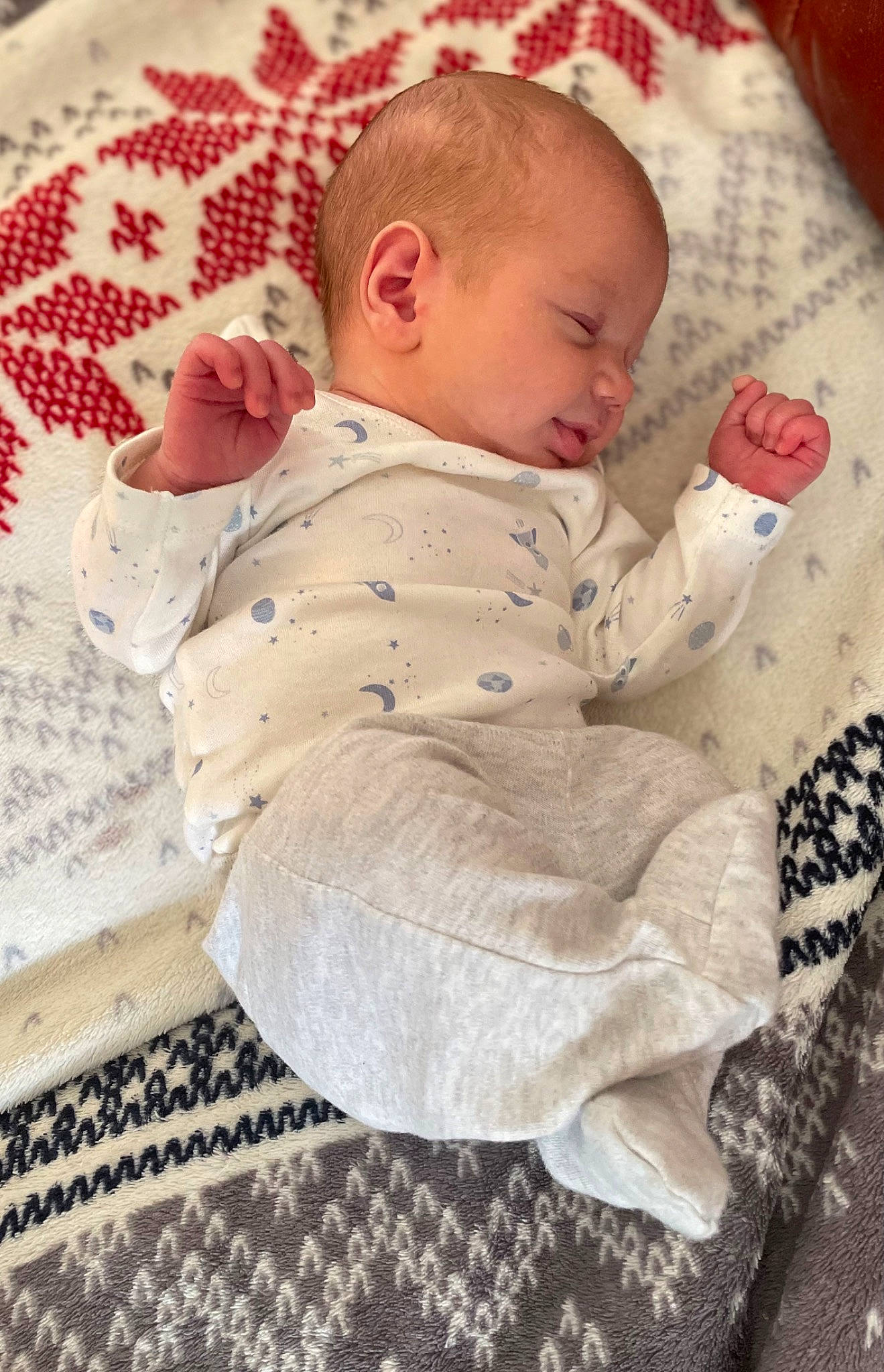 George is registered to the contest to win money with this photo: baby, baby_products, baby_safety, baby_sleeping, baby_toddler_clothing, bedding, bedtime, carmine, cheek, child, comfort, linens, pattern, person, room, sitting, skin, sleeve, toddler