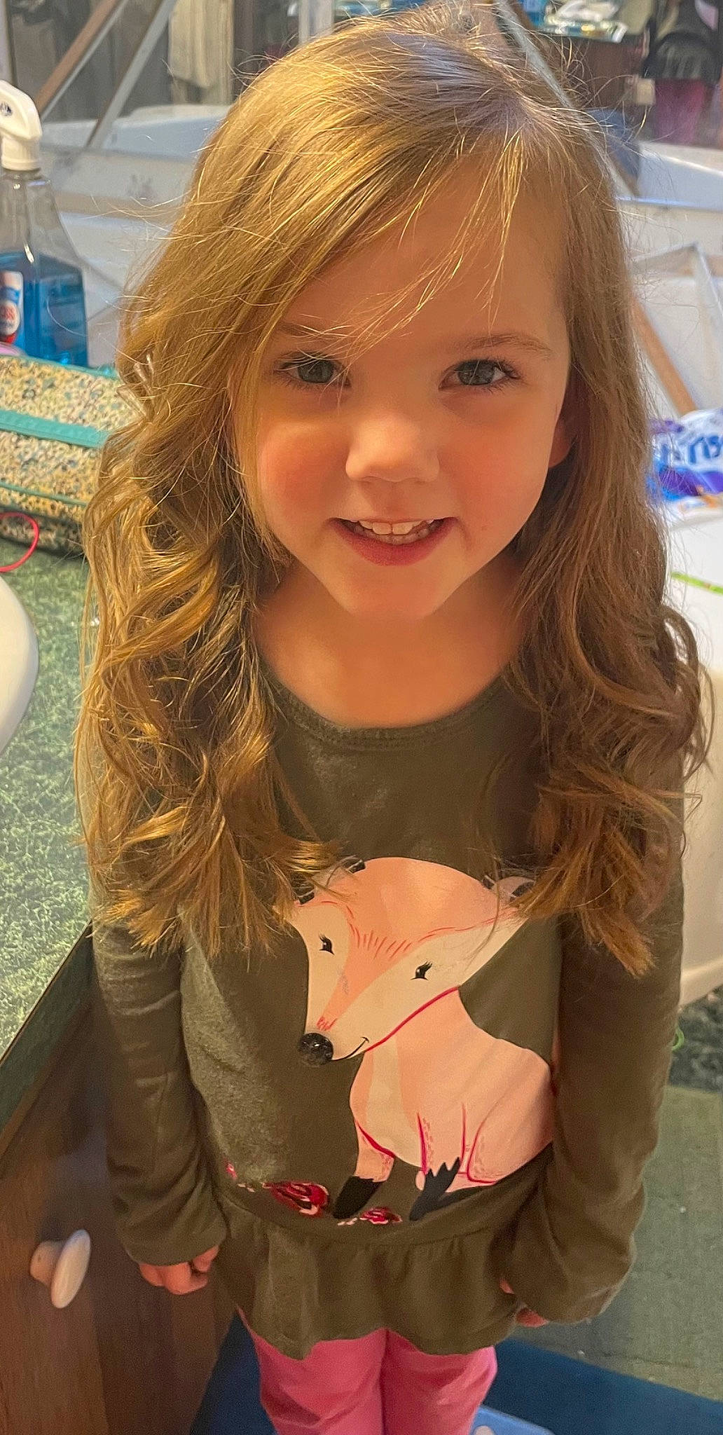 Annie is registered to the contest to win money with this photo: bangs, blond, brown_hair, cheek, child, chin, eyebrow, eyelash, hairstyle, happy, iris, layered_hair, lip, long_hair, neck, person, sleeve, smile, step_cutting, surfer_hair