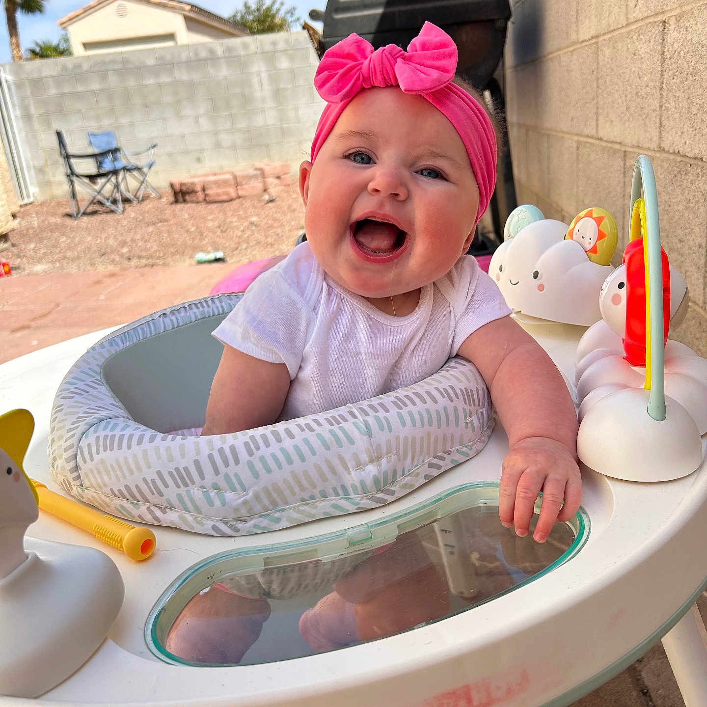 Maisley joined the competition — help win amazing prizes! architecture, baby, building, chair, city, clothing, face, furniture, happy, hat, head, outdoors, person, photography, plant, portrait, pottedplant, shelter, summer, table
