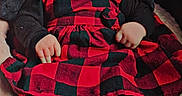 Aizzley is registered to the contest to win money with this photo: baby, black, blanket, checkered, child, clothing, cozy, cute, dress, expression, feet, indoors, infant, legs, portrait, red, sitting, timestamp, warm, weekend