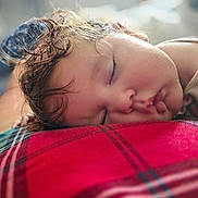 Aizzley is registered to the contest to win money with this photo: child, closeup, comfort, cozy, cute, face, hair, indoor, nap, peaceful, plaid, portrait, red, relaxation, rest, skin, sleeping, soft, toddler, young