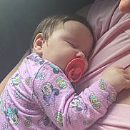 Aizzley is registered to the contest to win money with this photo: baby, sleeping, pacifier, pink_clothing, onesie, person, child, infant, cute, resting, toddler, mickey_mouse, soft_light, closeup, comfort, cuddling, nap, indoor, portrait, peaceful