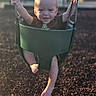 baby, swing, playground, child, smiling, outdoor, sunlight, chains, green_swing, barefoot, happy, play, infant, young_child, daylight, nature, park, person, fun, recreation