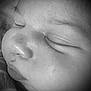 Kyrie is registered to the contest to win money with this photo: baby, closeup, sleeping, face, newborn, black_and_white, peaceful, skin, infant, portrait, nose, eyelids, cheeks, soft, cute, child, young, monochrome, quiet, rest