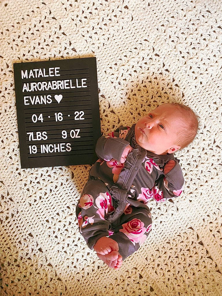 Matalee is registered to the contest to win money with this photo: baby, baby_sleeping, baby_toddler_clothing, child, comfort, crawling, flooring, font, happy, illustration, linens, magenta, number, pattern, person, rectangle, room, sitting, square, toddler