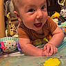 Maverick joined the competition — help win amazing prizes! baby, child, infant, smiling, happy, portrait, face, indoor, playmat, activity_mat, baby_toy, hanging_toys, giraffe_toy, colorful, sitting, leaning, brown_shirt, playtime, nursery, safe