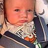 baby, infant, car_seat, pacifier, blue_eyes, clothing, seatbelt, child, cute, face, straps, safety, indoors, expression, young, person, head, closeup, comfort, toddler