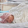 Emilia joined the competition — help win amazing prizes! newborn, baby, sleeping, blanket, pink_hat, bow, bassinet, hospital, infant, cute, peaceful, soft_lighting, white_blanket, wrapped, resting, closeup, face, headwear, indoors, portrait