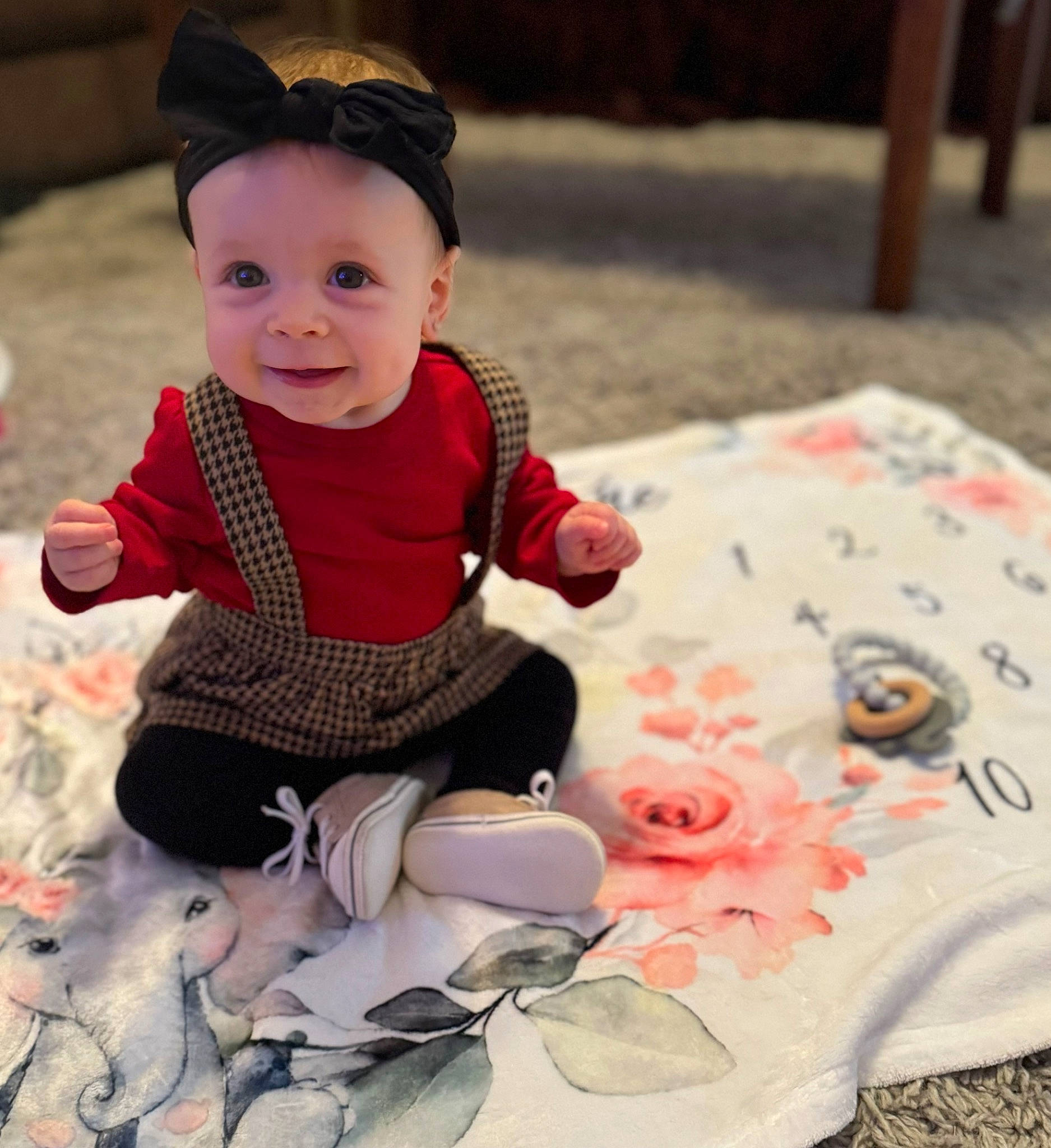 Callie joined the competition — help win amazing prizes! baby, baby_toddler_clothing, child, design, dress, grass, happy, hat, headwear, joy, linens, pattern, person, petal, pink, product, sitting, skin, sleeve, smile