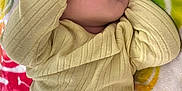 Danielle is registered to the contest to win money with this photo: baby, blanket, child, closeup, colorful, cozy, cute, face, hand, indoors, infant, nap, peaceful, person, portrait, resting, sleeping, soft, textile, yellow_sweater