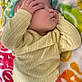 Danielle is registered to the contest to win money with this photo: baby, blanket, child, closeup, colorful, cozy, cute, face, hand, indoors, infant, nap, peaceful, person, portrait, resting, sleeping, soft, textile, yellow_sweater