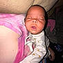 Love is registered to the contest to win money with this photo: baby, sleeping, pacifier, pajamas, bee_pattern, person, pink_shirt, tie_dye, indoor, close_up, infant, hand, blanket, resting, child, cute, comfort, young, face, cozy