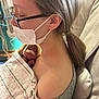 baby, premature_baby, hospital, medical_tubes, blanket, woman, glasses, mask, face, hair, person, holding, care, love, newborn, chair, comfort, indoor, healthcare, tenderness