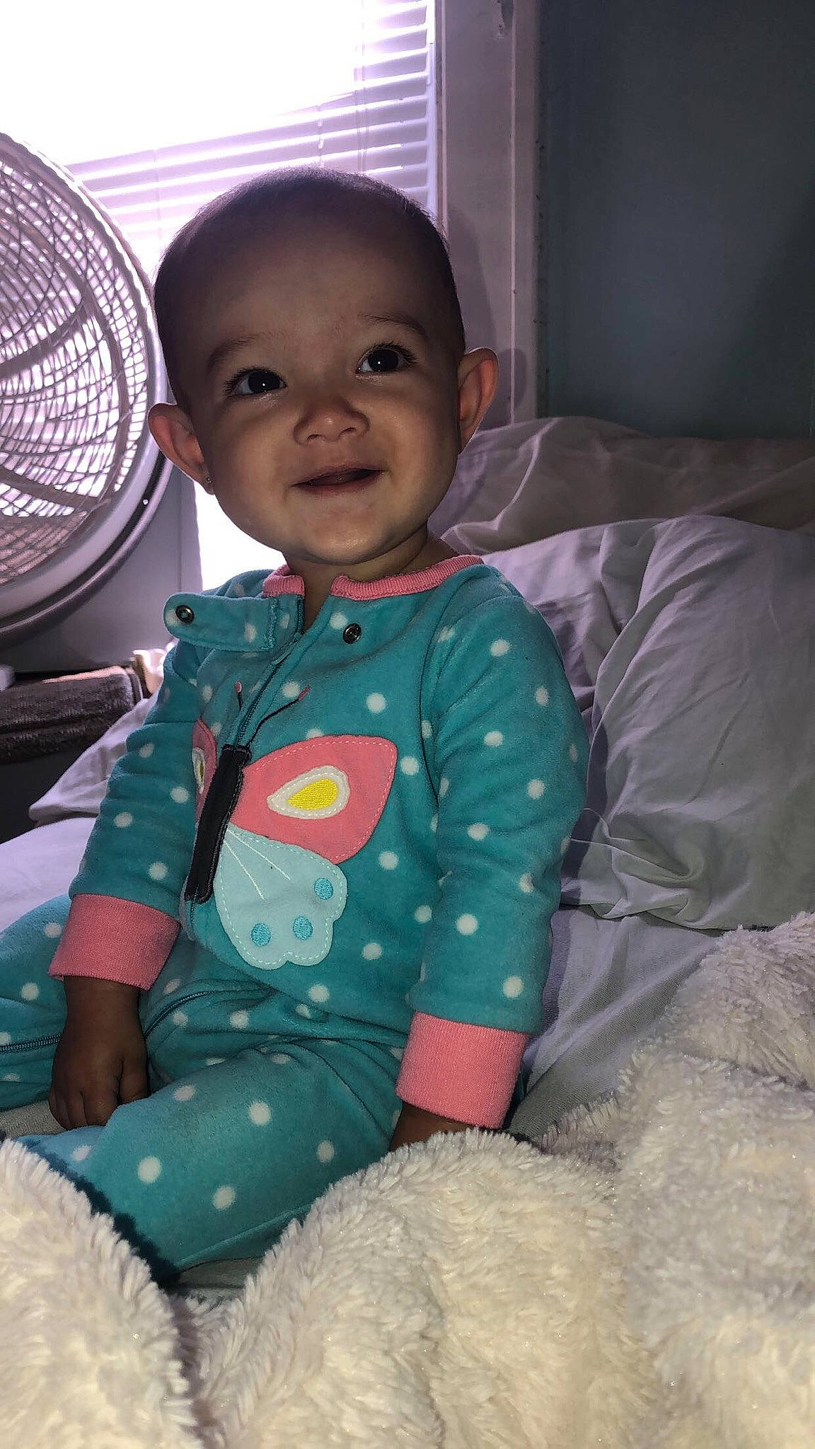 Ayana is registered to the contest to win money with this photo: baby, baby_toddler_clothing, cheek, child, eye, face, head, joy, person, sitting, skin, smile, toddler