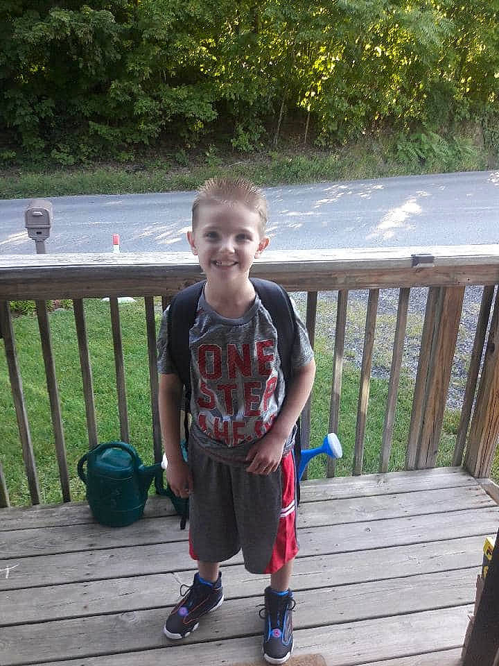 Lathan is registered to the contest to win money with this photo: child, deck, joy, leisure, person, play, shoe, standing, style, summer, t_shirt, toddler, tree, vacation