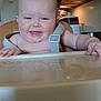 baby, high_chair, drool, smile, kitchen, infant, face, child, happy, seat, straps, skin, person, tongue, reflection, domestic, indoor, cute, chubby, table