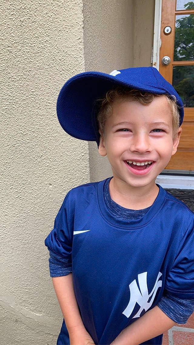 Bowie is registered to the contest to win money with this photo: blue, cap, chin, clothing, cool, eyebrow, eyewear, flash_photography, forehead, happy, hat, headgear, human_body, jaw, joy, lip, mouth, neck, person, shoulder