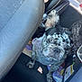 dog, french_bulldog, car_interior, car_seat, dog_harness, blanket, animal, pet, back_seat, window, seat_cover, daylight, car_door, leash, vehicle, curious, standing, canine, travel, companion
