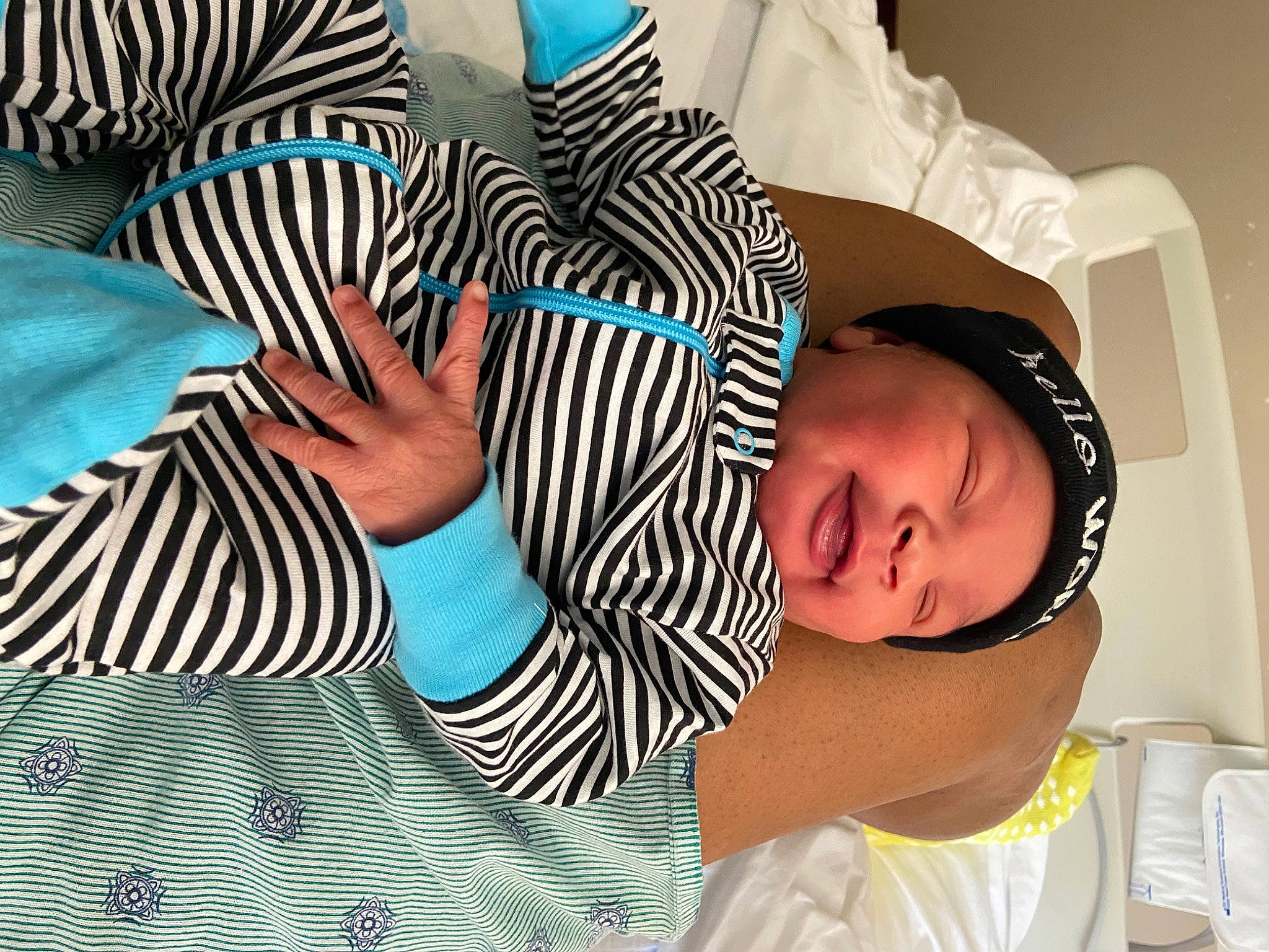 Johnathan is registered to the contest to win money with this photo: arm, baby, baby_toddler_clothing, blue, child, comfort, cool, elbow, eyelash, fashion, finger, fun, hairstyle, happy, hat, headgear, headwear, human_body, person, sleeve