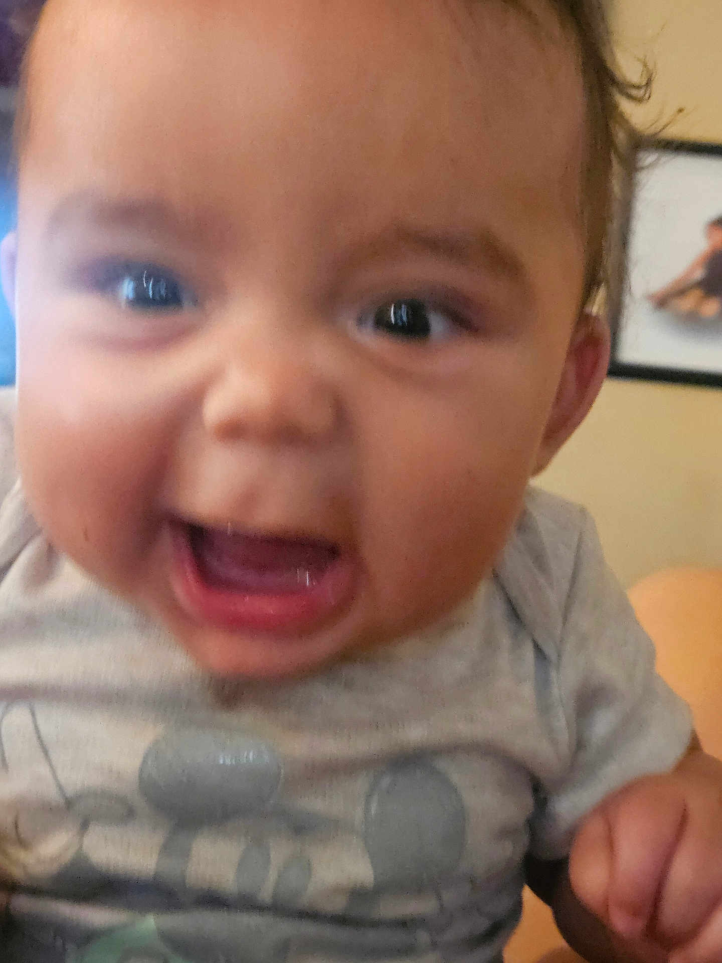 Kyree joined the competition — help win amazing prizes! baby, close_up, face, mouth_open, eyes, gray_shirt, cartoon_character, hand, indoor, person, child, expression, blur, portrait, cute, young, skin, hair, background, frame