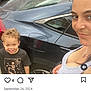 Keyon Carter is registered to the contest to win money with this photo: child, woman, car, parking_lot, smiling, casual, outdoor, sidewalk, black_shirt, skeleton_design, curly_hair, headband, person, vehicle, street, daylight, happy, portrait, people, urban