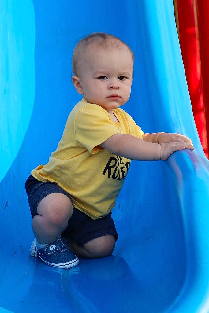 Brandon joined the competition — help win amazing prizes! azure, baby, baby_toddler_clothing, blue, child, chute, electric_blue, flash_photography, fun, happy, human_leg, knee, leisure, person, playground, recreation, shorts, sleeve, standing, thigh