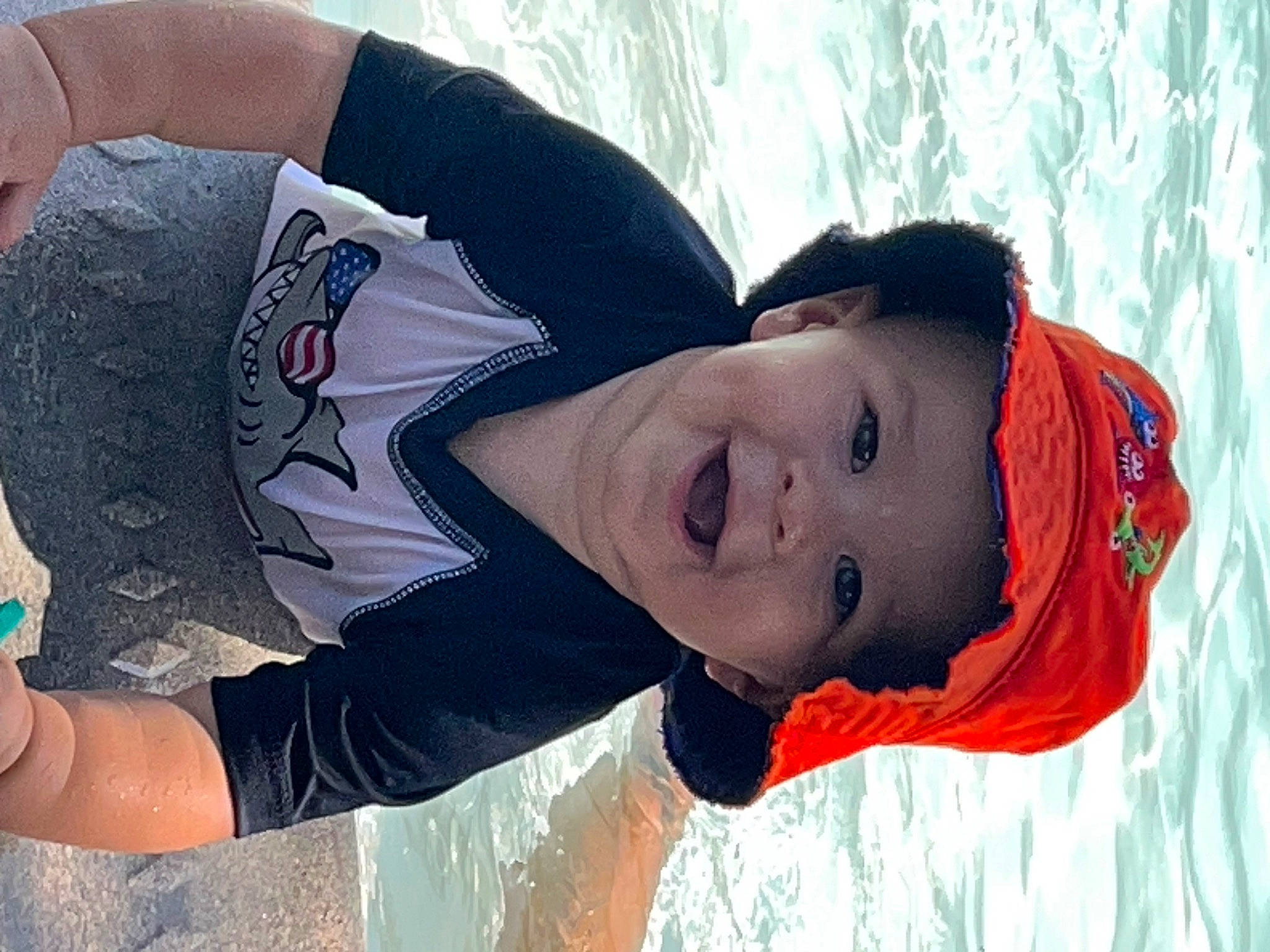 Brandon is registered to the contest to win money with this photo: black_hair, child, cool, elbow, freezing, fun, happy, headwear, human_body, leisure, mouth, ocean, people_in_nature, person, playing_in_the_snow, recreation, smile, snow, toddler, tree