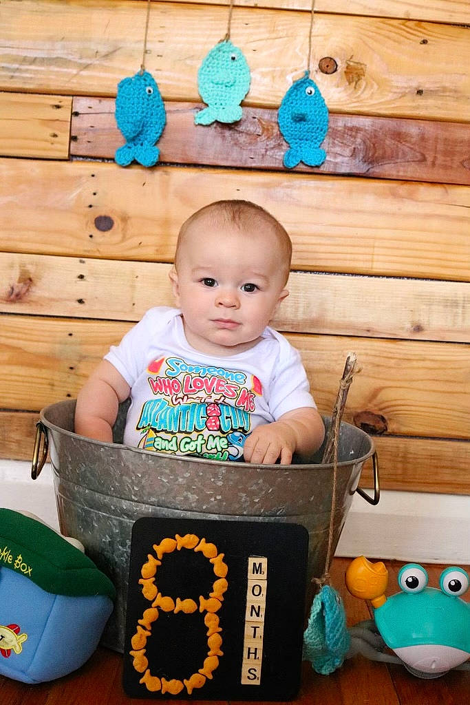 Brandon joined the competition — help win amazing prizes! baby, baby_products, baby_toddler_clothing, bib, blue, chair, child, fun, green, happy, logo, person, plastic, play, portrait_photography, product, room, sitting, t_shirt, toddler