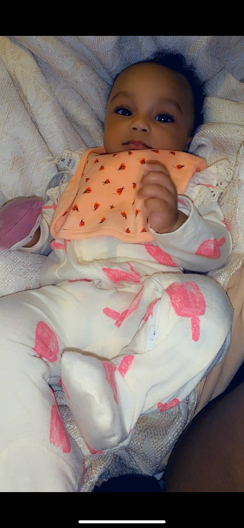 Kamari is registered to the contest to win money with this photo: baby, baby_safety, baby_sleeping, baby_toddler_clothing, cheek, child, comfort, finger, linens, lip, mouth, nose, person, pink, red, skin, sleeve, textile, thumb, toddler