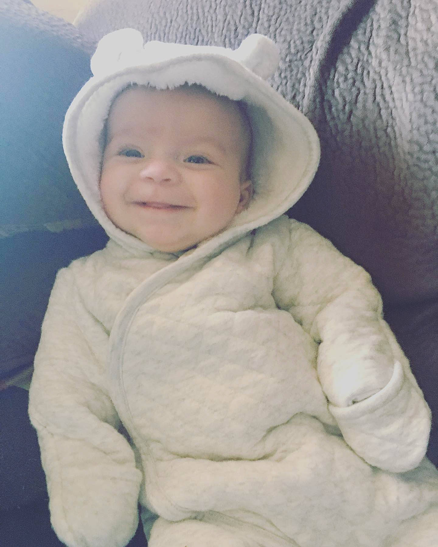Alexandra is registered to the contest to win money with this photo: baby, baby_toddler_clothing, cap, cheek, comfort, eye, eyebrow, flash_photography, freezing, happy, headgear, iris, jacket, nose, outerwear, parka, person, sleeve, smile, toddler