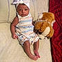 Dariyah is registered to the contest to win money with this photo: abdomen, arm, baby, baby_sleeping, baby_toddler_clothing, comfort, dress, fawn, finger, hand, head, human_body, linens, sitting, skin, textile, toddler, toy, trunk, vertebrate