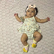 Gabriella is registered to the contest to win money with this photo: baby, infant, child, pink_blanket, headband, bow, socks, winnie_the_pooh, cute, lying_down, clothing, infant_clothing, soft_texture, indoors, person, adorable, sleepwear, baby_girl, plush, pacifier_clip