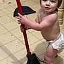 toddler, child, diaper, broom, floor, tile_floor, indoor, cleaning, messy, curious, baby, person, standing, hands, face, hair, leg, room, household, domestic