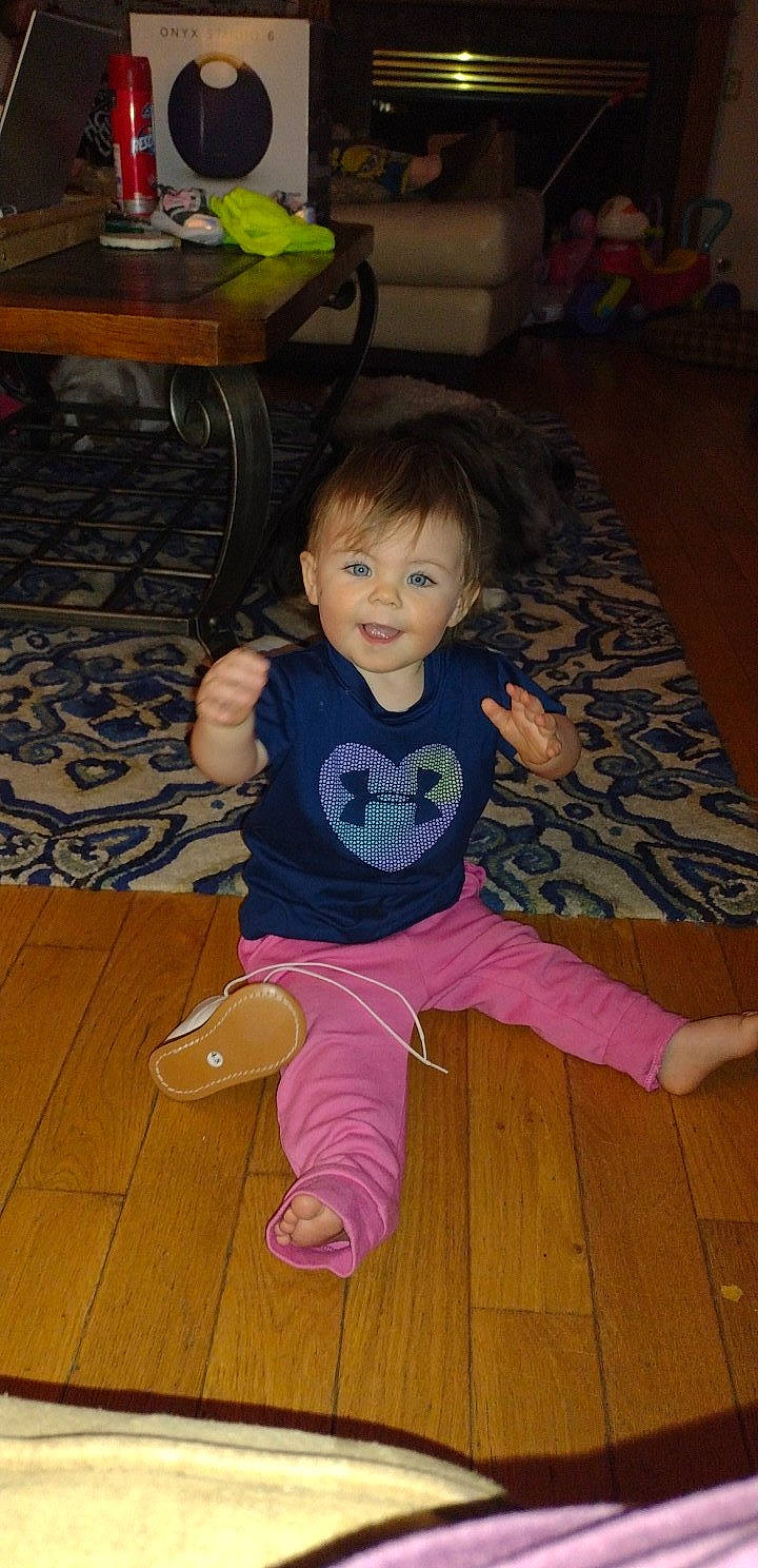 Delaney joined the competition — help win amazing prizes! baby_toddler_clothing, black, cheek, child, comfort, eye, floor, flooring, fun, hair, happy, hardwood, head, person, skin, smile, standing, toddler, varnish, wood