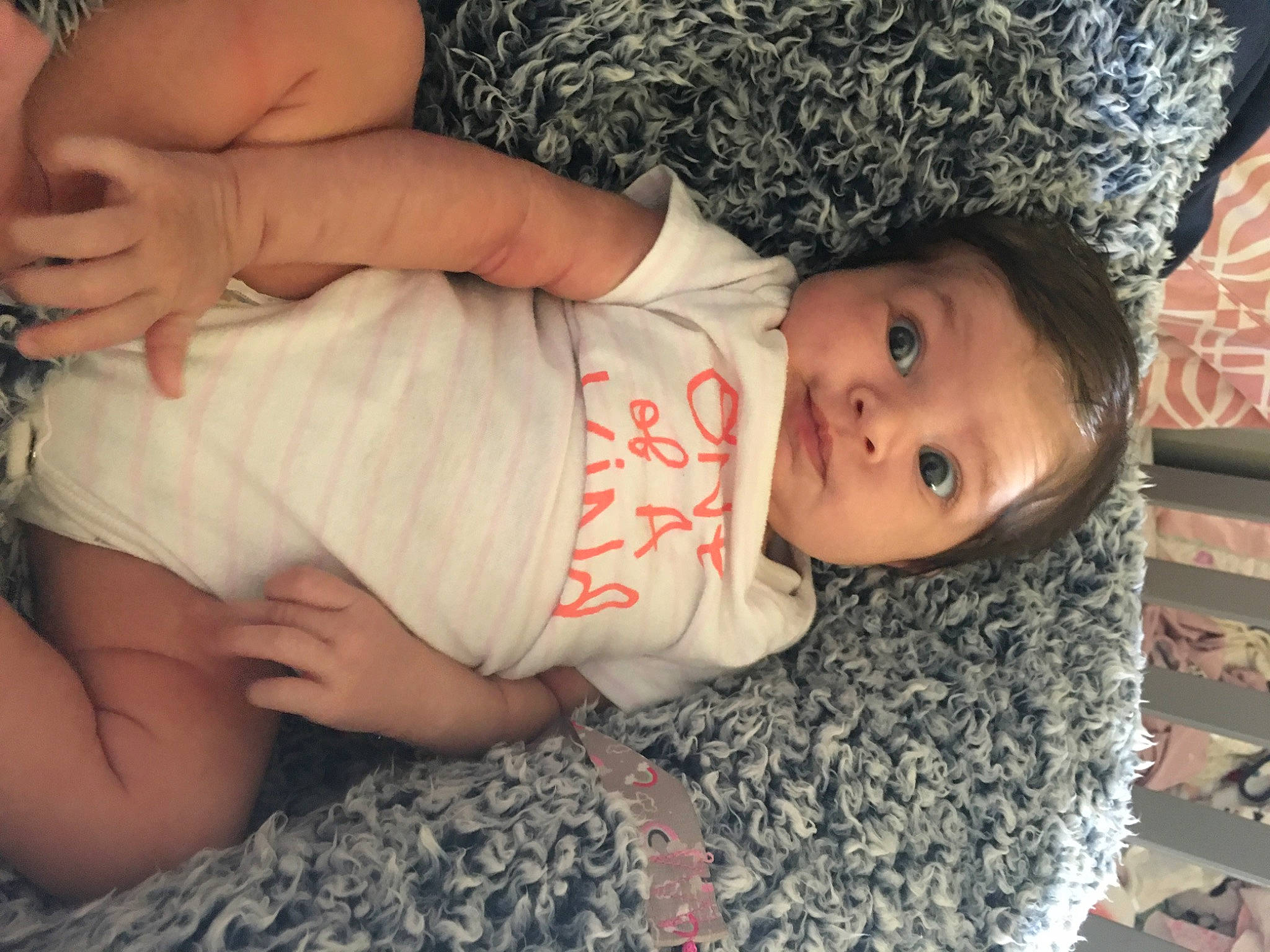 Nova is registered to the contest to win money with this photo: arm, baby, baby_toddler_clothing, cheek, eye, facial_expression, finger, gesture, hairstyle, hand, head, human_body, iris, lip, mouth, nose, person, skin, sleeve, textile