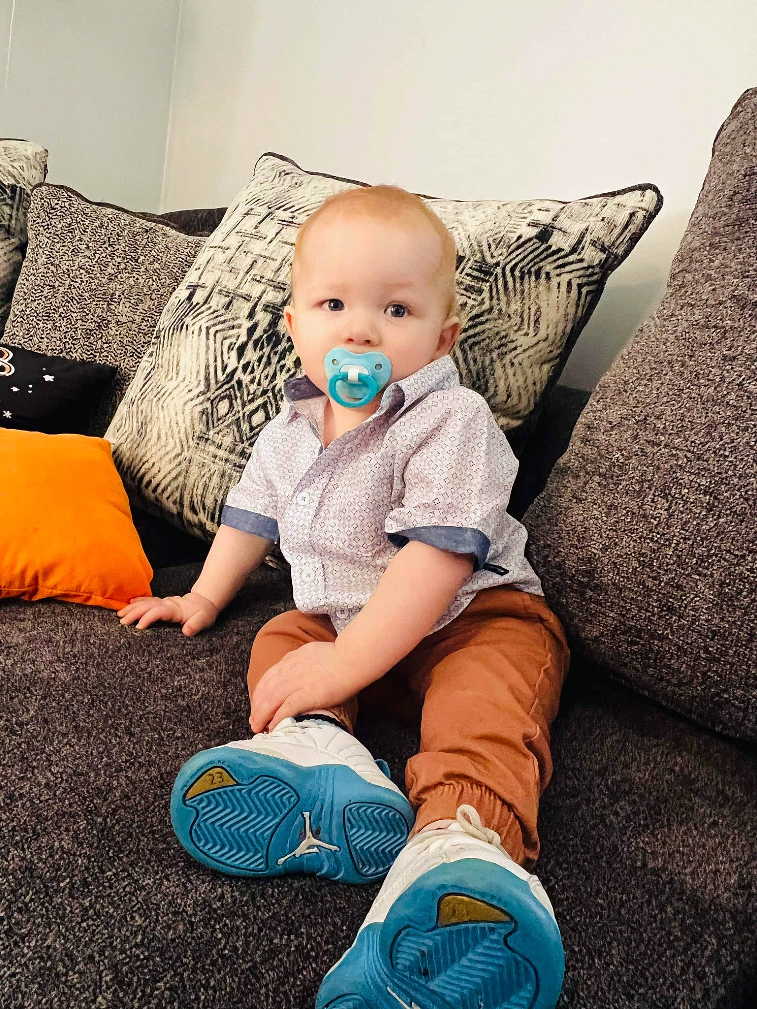 Lloyd joined the competition — help win amazing prizes! baby, baby_toddler_clothing, blue, child, comfort, couch, denim, electric_blue, flooring, foot, fun, happy, human_leg, knee, person, sitting, t_shirt, textile, thigh, toddler