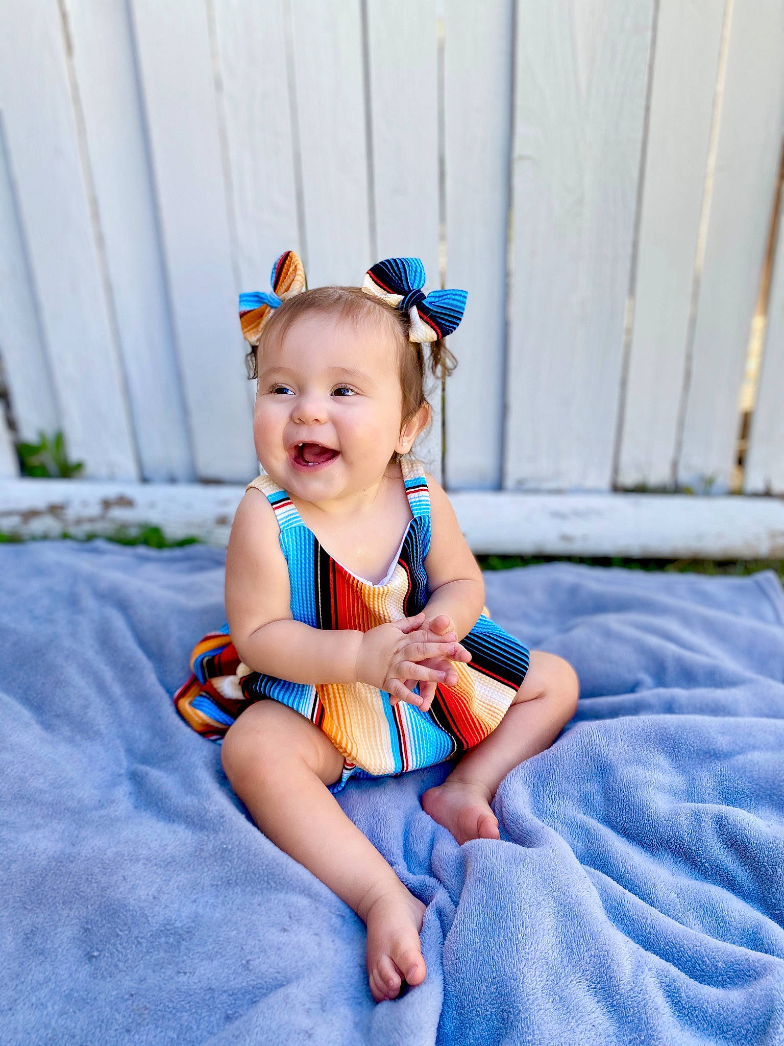 Remy is registered to the contest to win money with this photo: baby, baby_toddler_clothing, blue, child, child_model, ear, fun, hair_accessory, happy, person, photograph, photography, play, product, sitting, skin, smile, snapshot, toddler, vacation