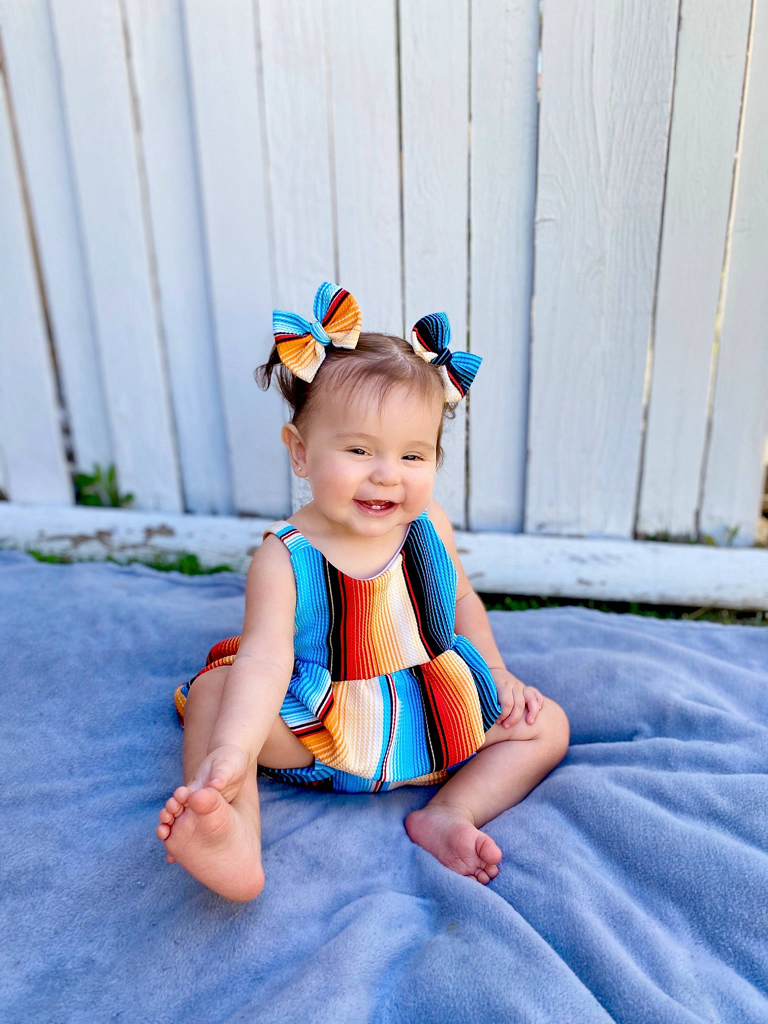 Remy is registered to the contest to win money with this photo: baby, baby_toddler_clothing, beauty, blue, child, crown, design, dress, hair_accessory, headgear, joy, pattern, person, photograph, photography, product, sitting, skin, smile, toddler