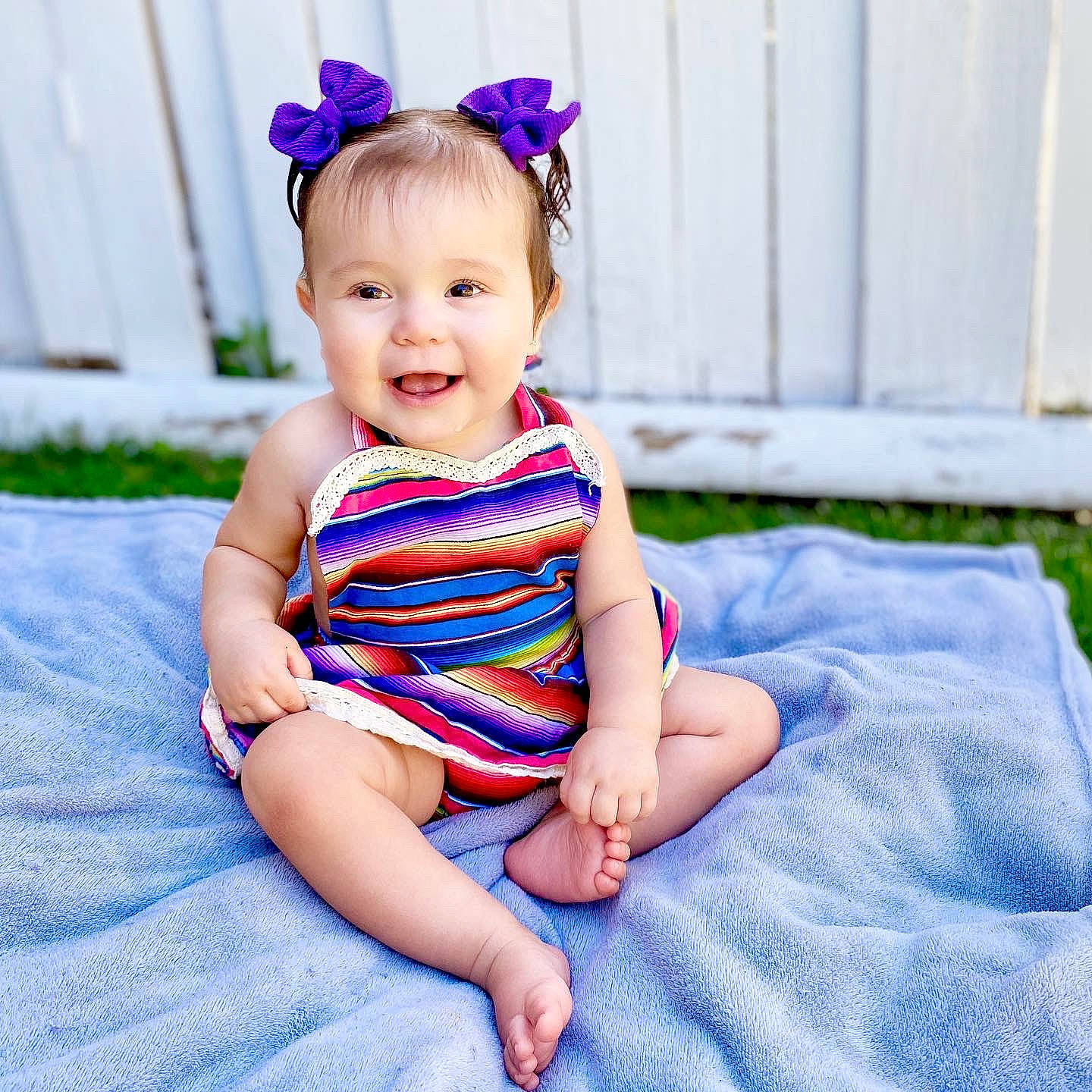 Remy joined the competition — help win amazing prizes! baby, baby_products, baby_toddler_clothing, blue, child, child_model, clothing, design, dress, hair_accessory, headgear, joy, pattern, person, pink, product, purple, sitting, skin, smile