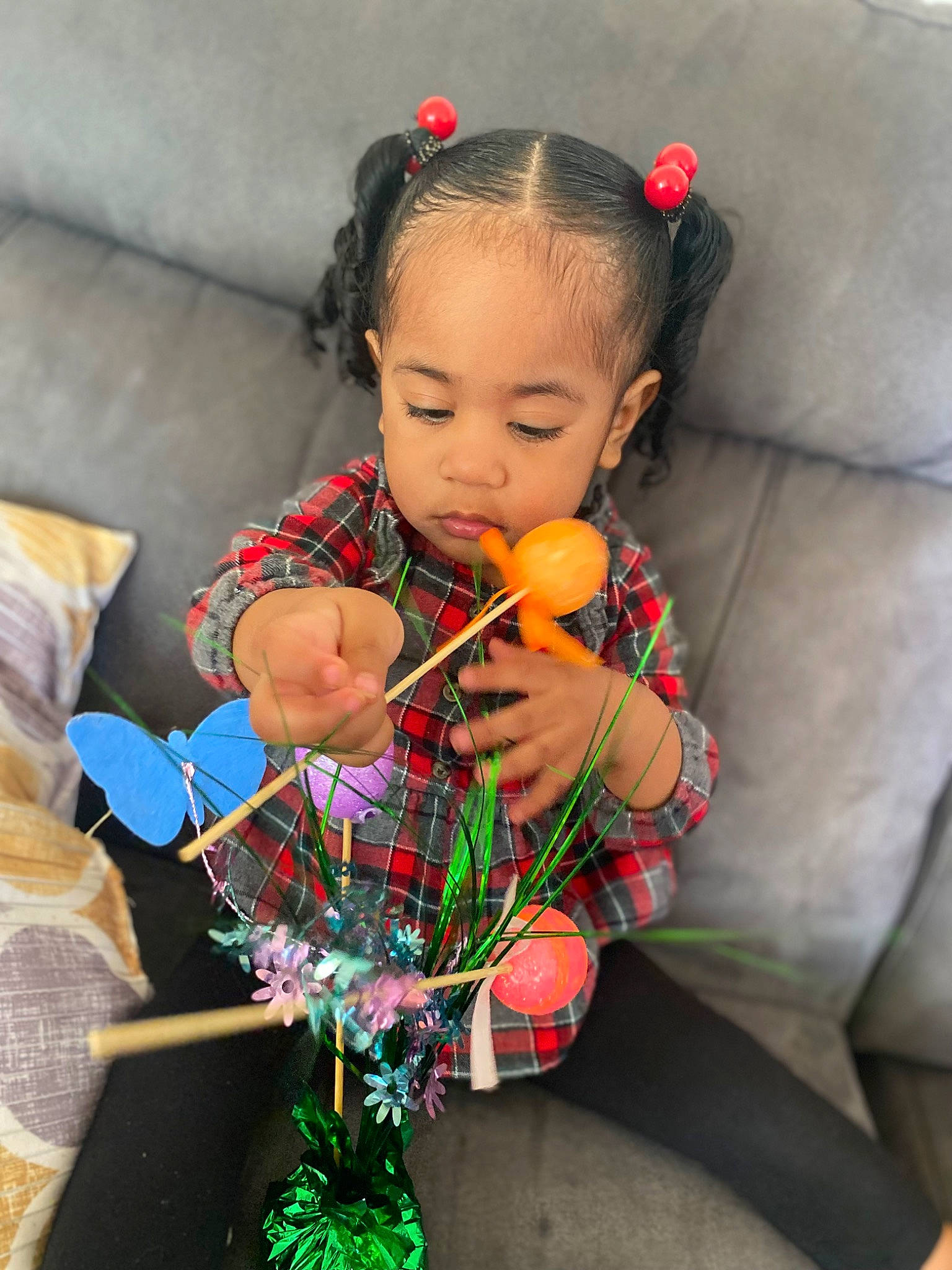 Cataleya is registered to the contest to win money with this photo: baby_toddler_clothing, child, christmas_decoration, christmas_ornament, couch, dress, event, face, fashion_accessory, hair, happy, head, human_body, ornament, pattern, person, sitting, skin, toddler, tradition