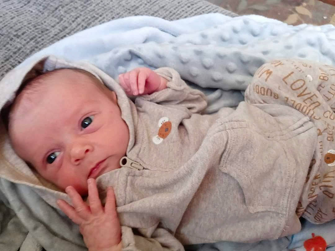 Justin joined the competition — help win amazing prizes! baby, baby_products, baby_sleeping, baby_toddler_clothing, cheek, child, chin, comfort, grass, linens, mammal, nose, pattern, person, portrait_photography, product, sitting, skin, sleeve, toddler